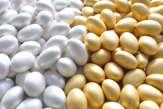 Milk Chocolate Covered Almonds coated with a silver & gold candy shell